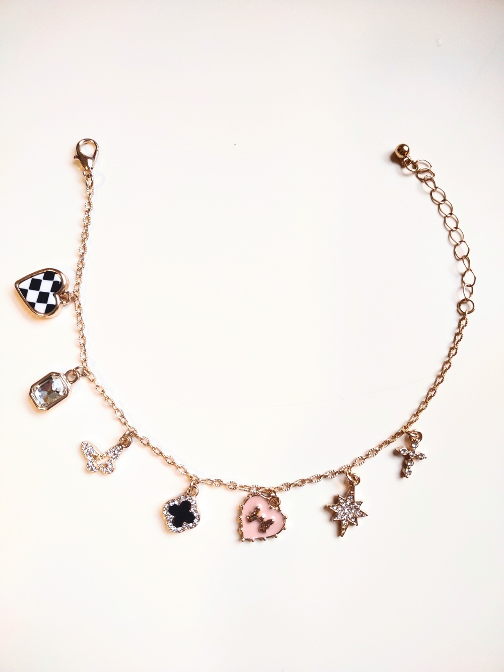 Gold Charm Bracelet with Checkered Heart, Cross, Jewels, Pink Heart with Bow